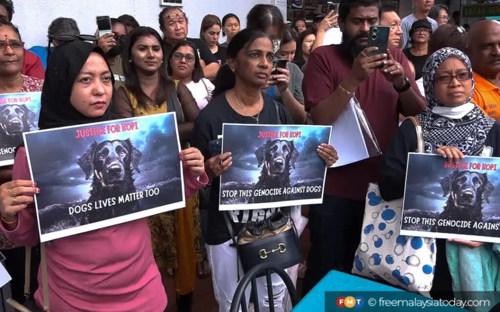 People gathered outside the Sentul police station in solidarity for a dog named Kopi as several animal rights groups filed a report against the Besut district council.